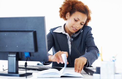 Attractive African American woman busy at workplace; Shutterstock ID 83079331; PO: The Huffington Post; Job: The Huffington Post; Client: The Huffington Post; Other: The Huffington Post